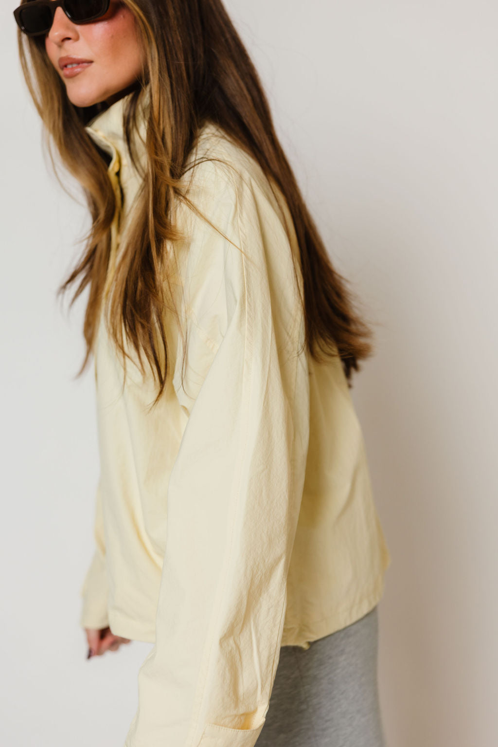 Drew Utility Windbreaker Jacket in Buttercream, styled view