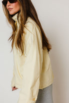 Drew Utility Windbreaker Jacket in Buttercream, styled view