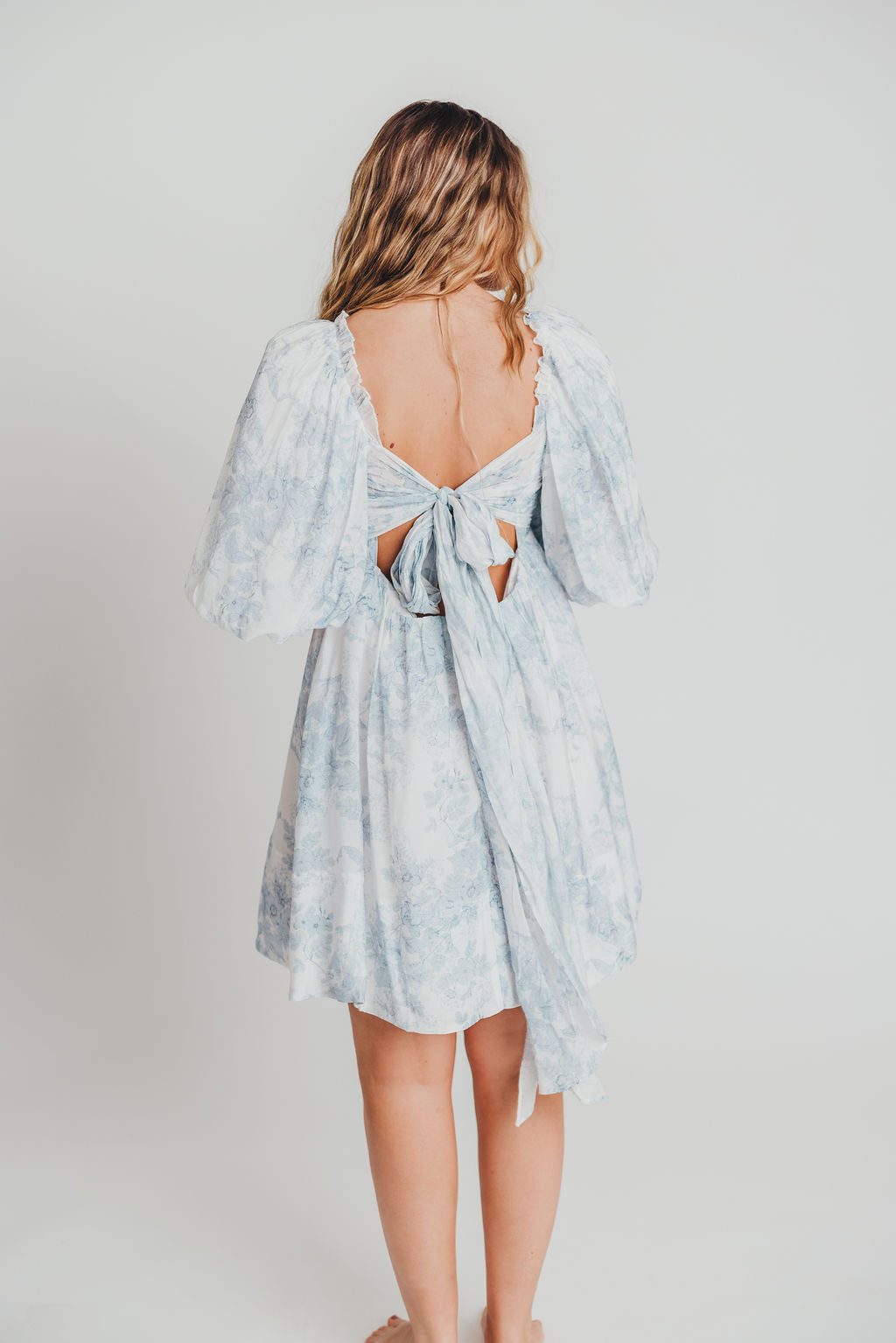 Melody Mini Dress with Pleats and Bow Detail in Baby Blue Floral